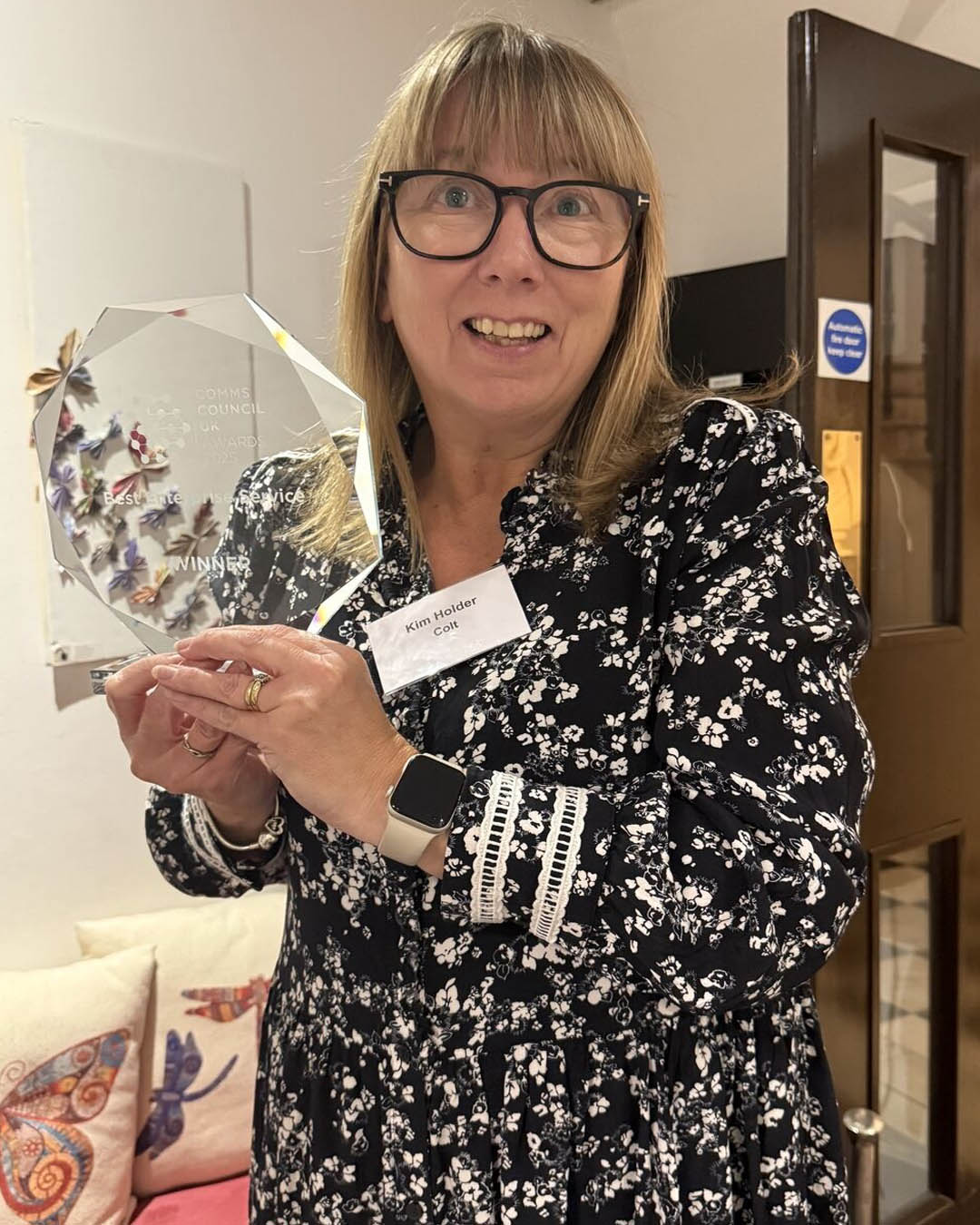 Colt Director Kim Holder steps forward to show Colts award